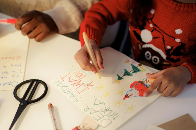 Children crafting heartfelt letters to Santa, full of creativity and holiday cheer.
